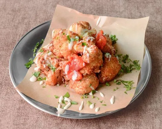 Balagan: coliflor con tomate, tahini y hierbas